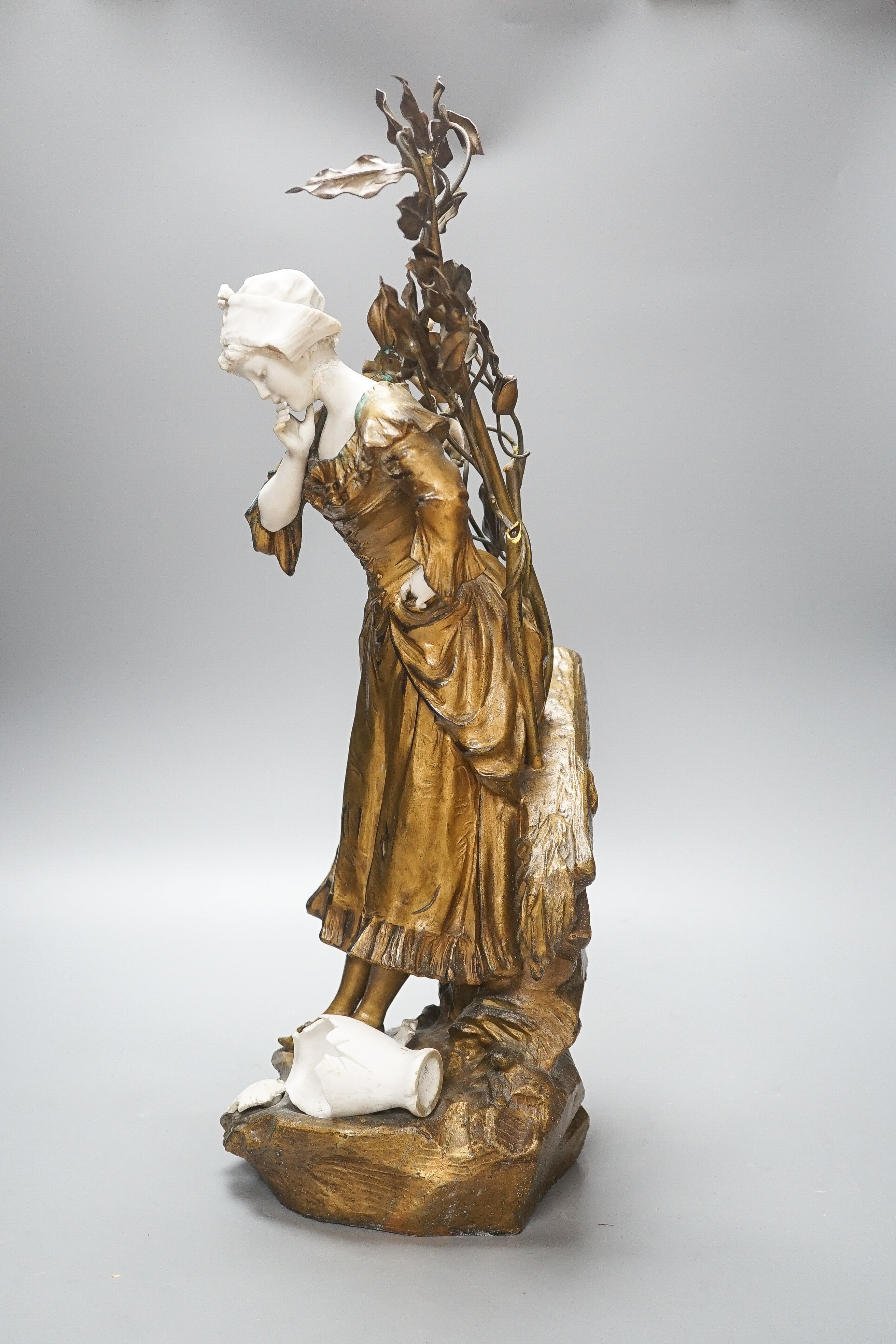 A late 19th Century French gilt spelter and bisque porcelain figure after Mednat 54cm